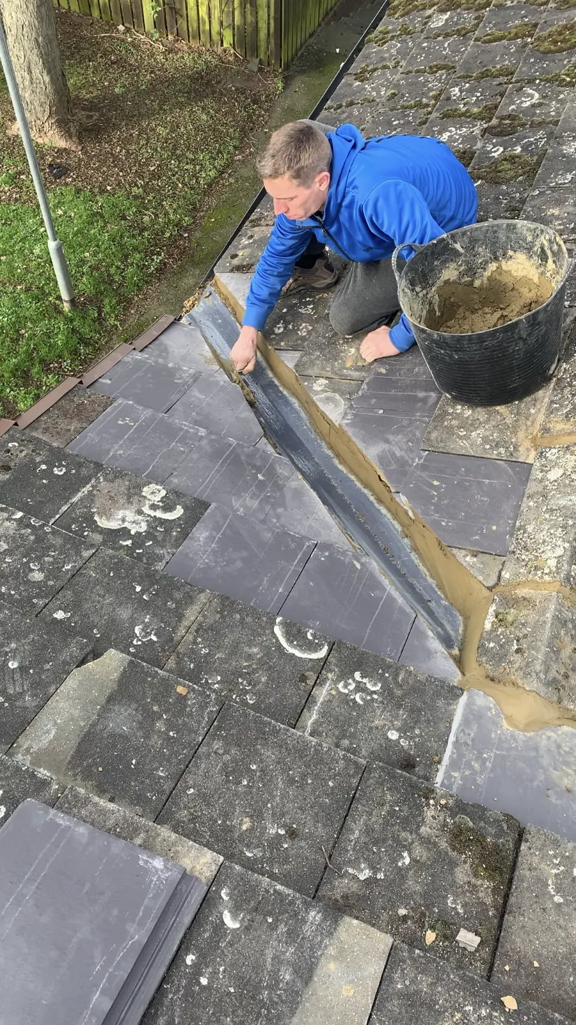 Valley being repaired on a slate roof