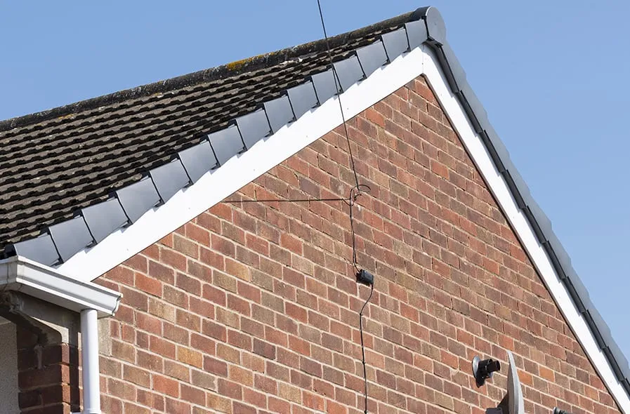 White fascias and dry verge on gable