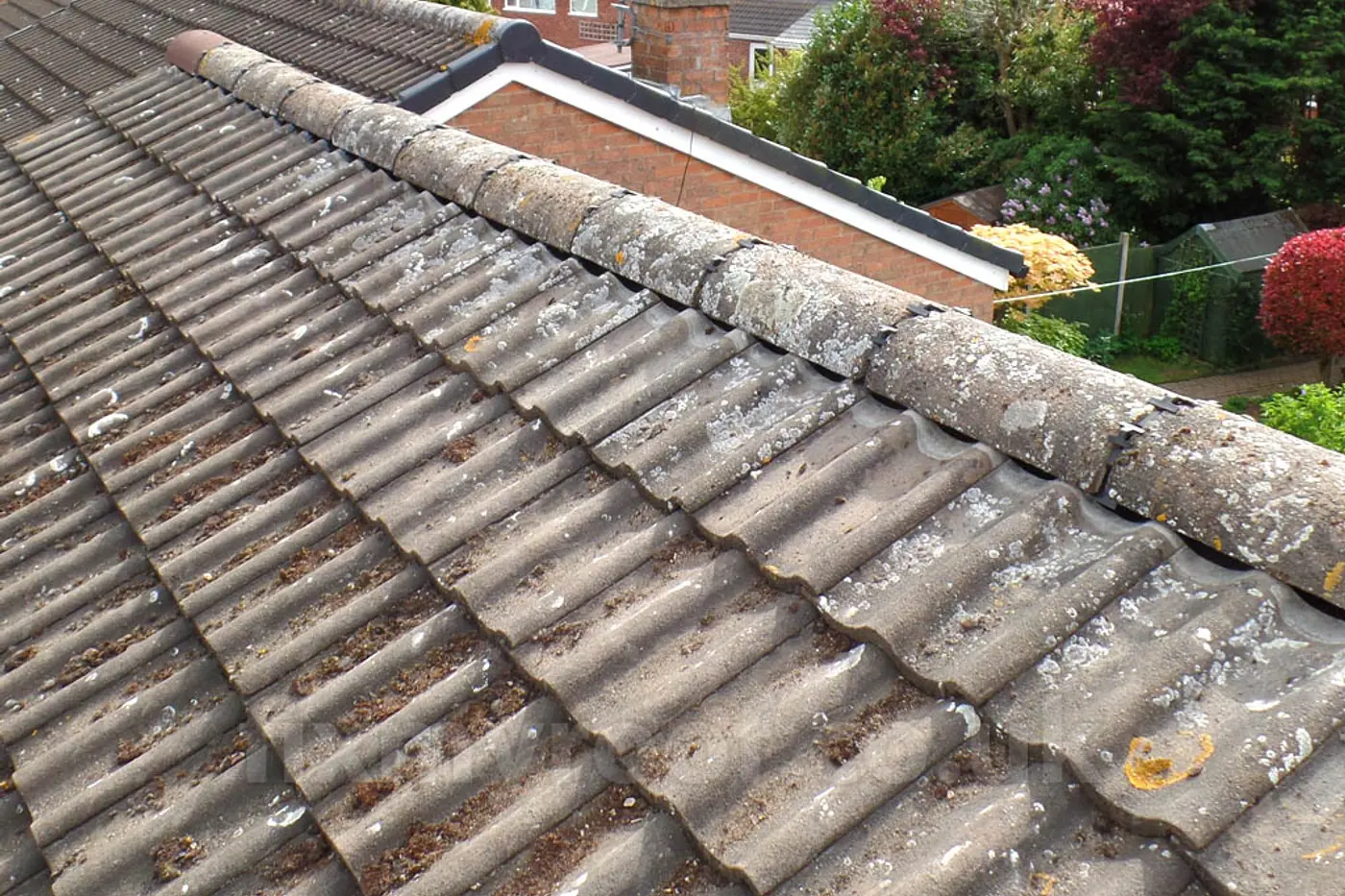 Ridge tiles re-bedded on a tiled roof